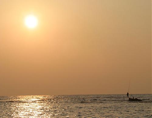 fisherman-in-sunset.jpg‏